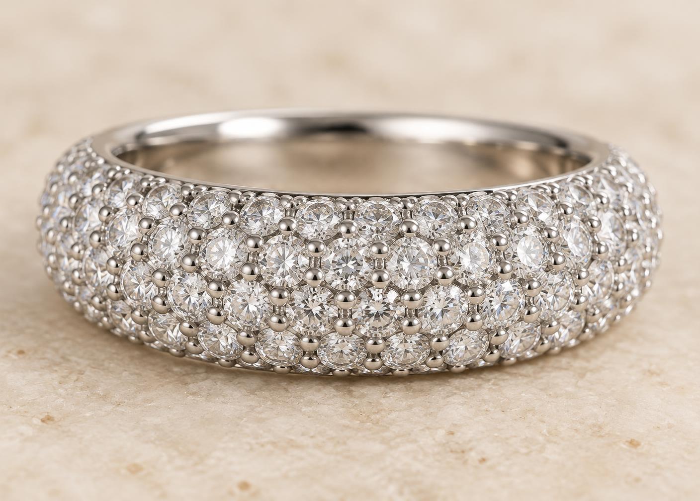 Many small diamonds set closely together with tiny shared metal beads