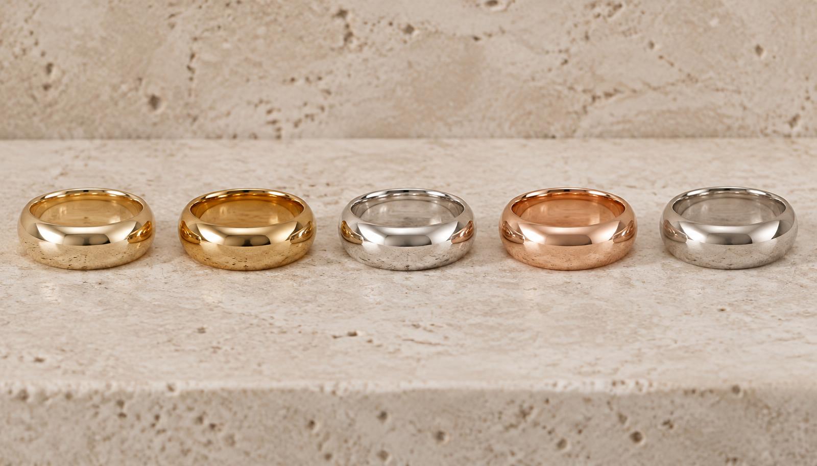 Yellow gold, white gold, rose gold, and platinum bands compared under consistent neutral light