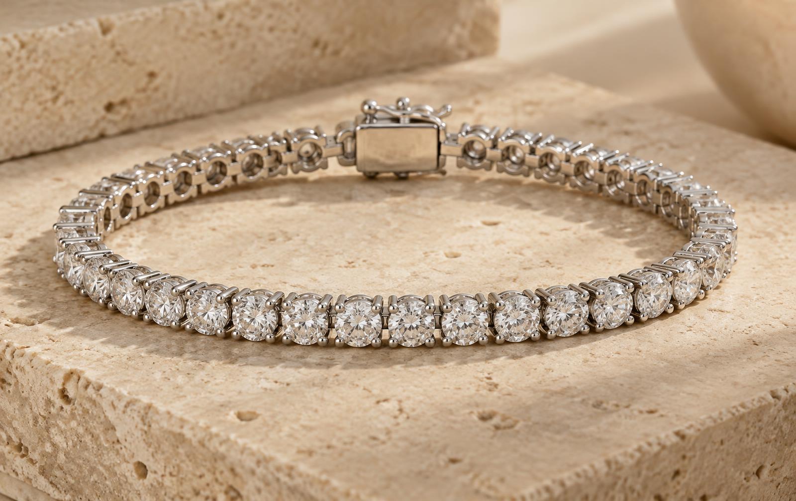 Macro diamond tennis bracelet showing individual settings, flexible articulated links and a box clasp